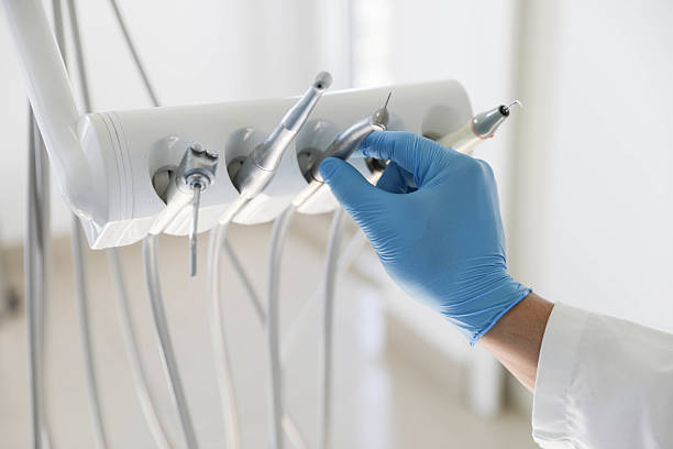 Professional Tooth Extraction technician working in Johnson County County, IA